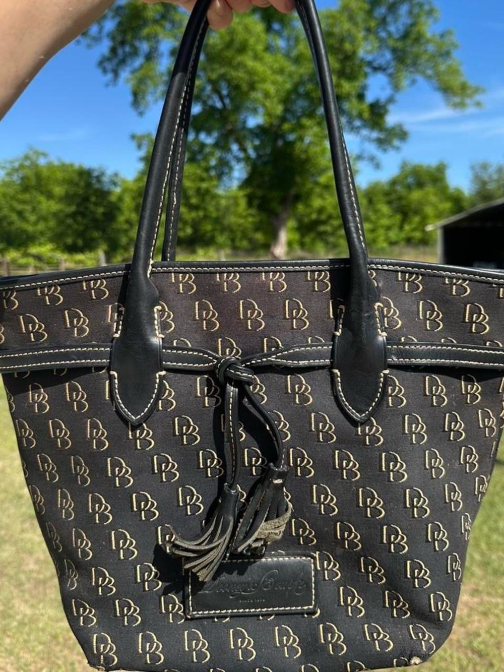 Dooney & Bourke Black and Gold Monogram Tote with Tassel